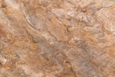 Doğal ham taş kahverengi granitin kusursuz arkaplan dokusu