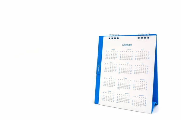 Calendrier spirale de bureau en papier blanc sur fond blanc . — Photo