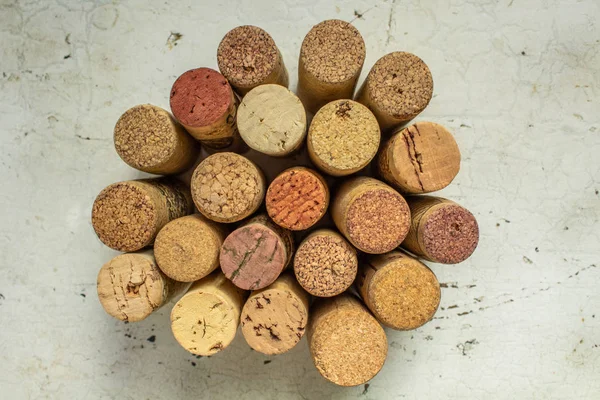 used white and red wine corks on wooden table