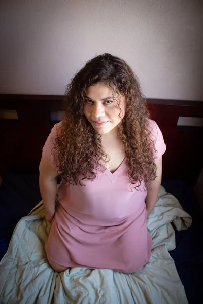 mexican woman with latin appearance with curly hair
