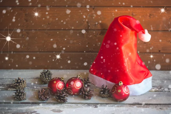 Santa Hat Pine Cones Christmas Balls Aged Wooden Table Wooden — Stock Photo, Image