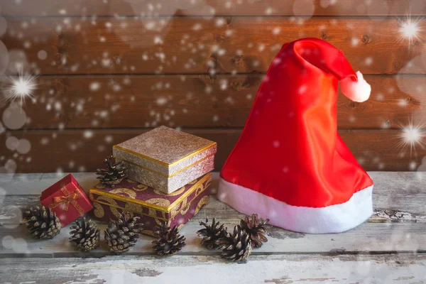 Santa Hat Christmas Gifts Pine Cones Aged Wooden Table Wooden — Stock Photo, Image