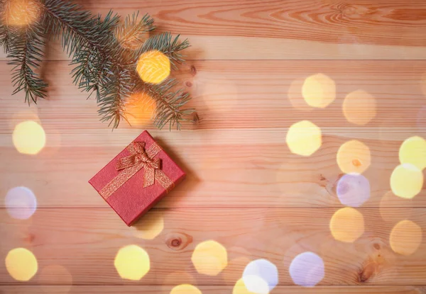 Red gift box and fir branch. Top view, copy space. — Stock Photo, Image
