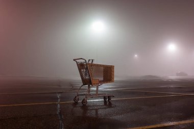 Abandoned Shopping Cart on a foggy spring evening in Ann Arbor, Michigan clipart