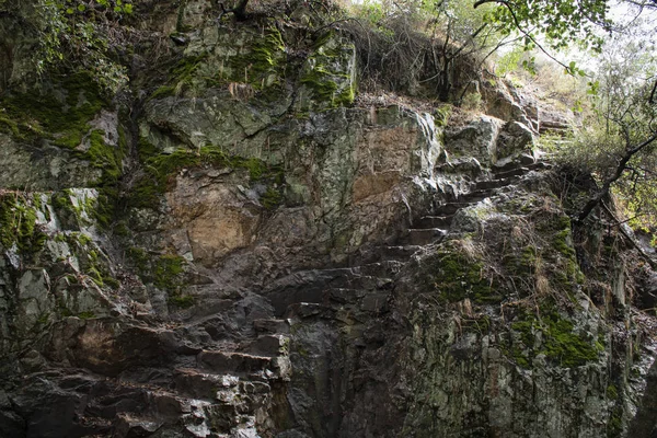 Steep carved rock stairs