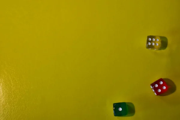 Yellow background with three dice.