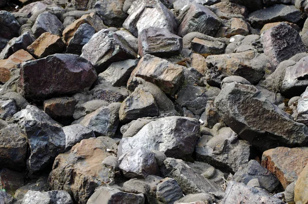 Cobblestones, partly painted with silver color — Stock Photo, Image