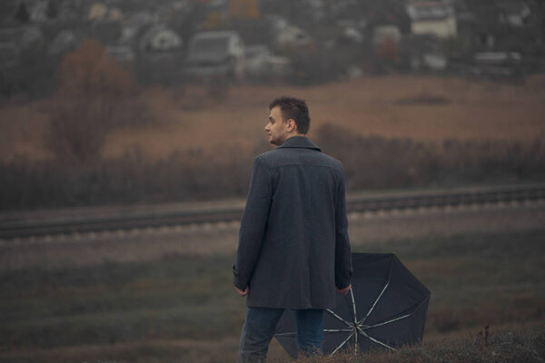Lonely man with umbrella