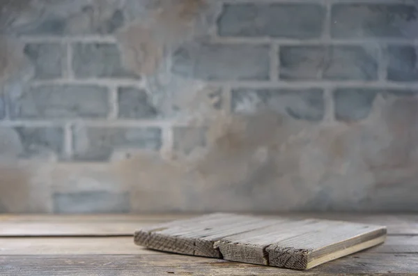 Rustic kitchen table and old concrete wall on the background