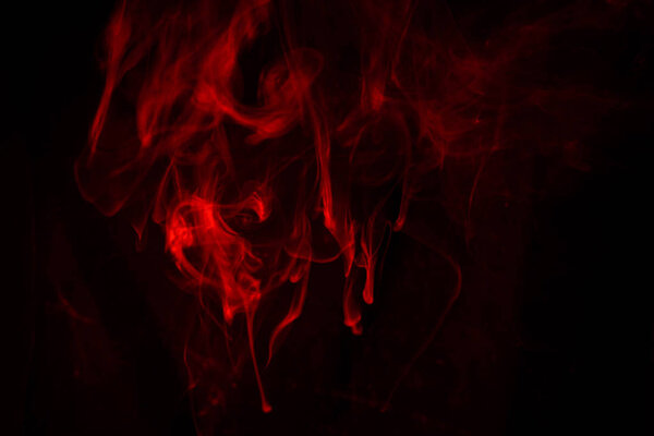 Texture of red smoke on black background