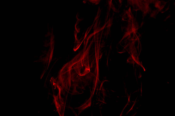 Red steam on black, close up