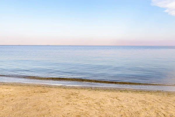 Sunset on the sea beach. Horizontal landscape.