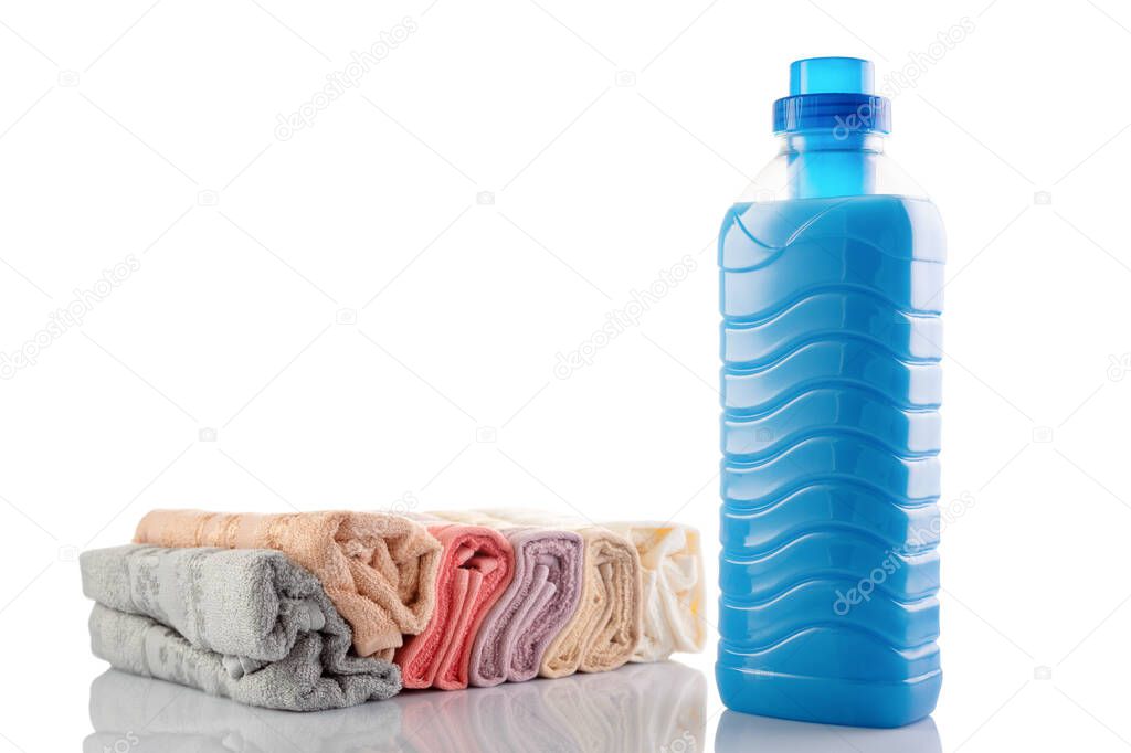 Fabric softener with fresh towels on a white background