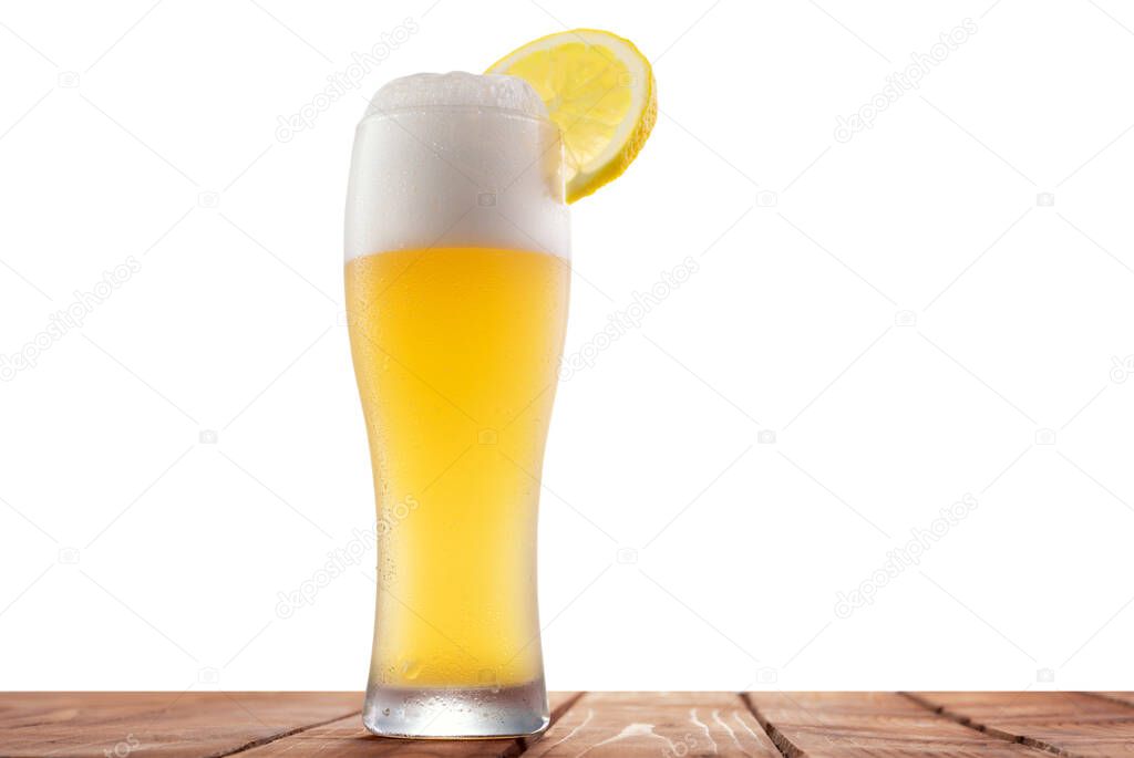 White beer with lemon on an isolated background