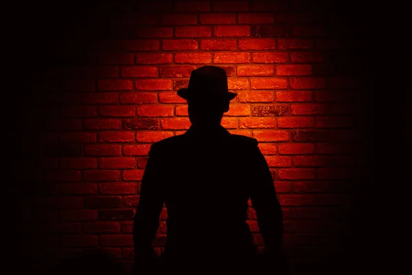 Silhouette Man Hat Brick Background Noir Crime — Stock Photo, Image