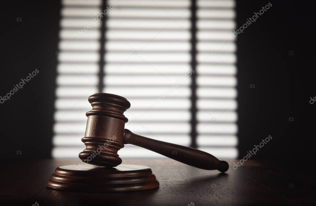 Judge (auction) gavel in the office against the background of a 