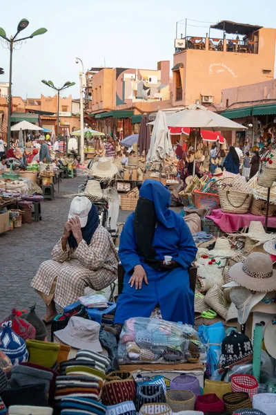 Women with niqab selling in a square in the medina of Marrakech in October 2019 — ストック写真