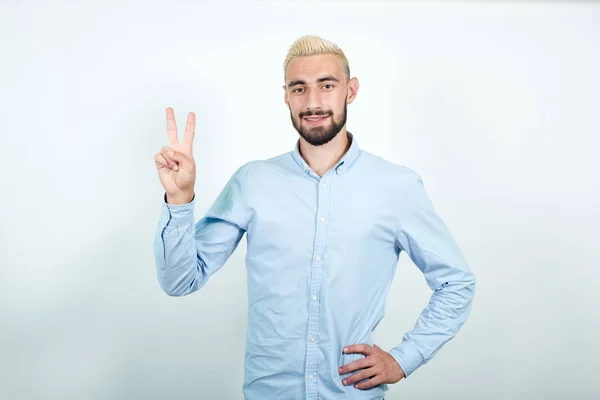Man with blond hair, black beard over isolated white background shows emotions — Stock Photo, Image