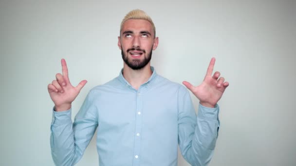 Man with blond hair, black beard over isolated white background shows emotions — Stock Video