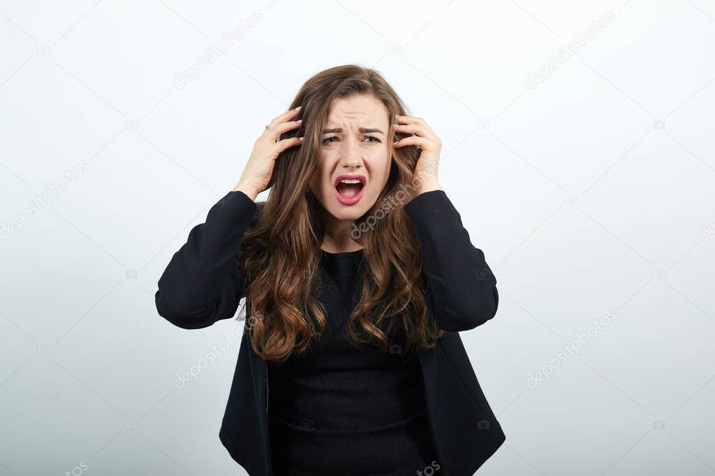 Angry, Irritated Female Holds Hands To Her Head And Screams. Peoples Hysteria