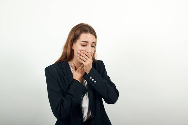 Coughs, covers mouth with hand. Shot for articles diseases of upper respiratory