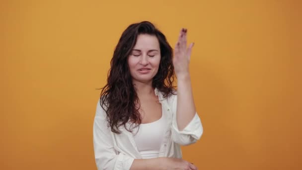 Closing face palm covers eyes visible through with hands. Young attractive woman — Stock Video