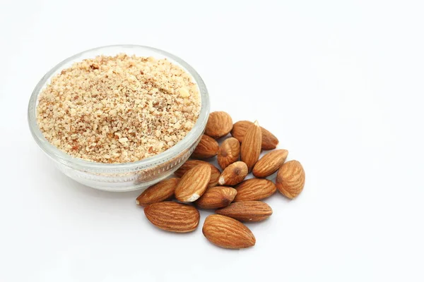 Whole and ground almonds on white background. — Stock Photo, Image