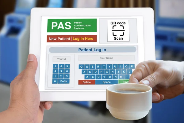 Patient administration system application showing on digital tablet screen in someone hand.