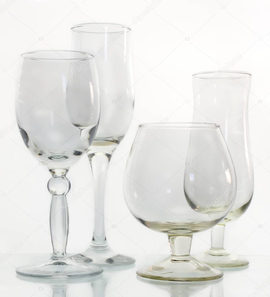 Empty wine glasses on a glass surface