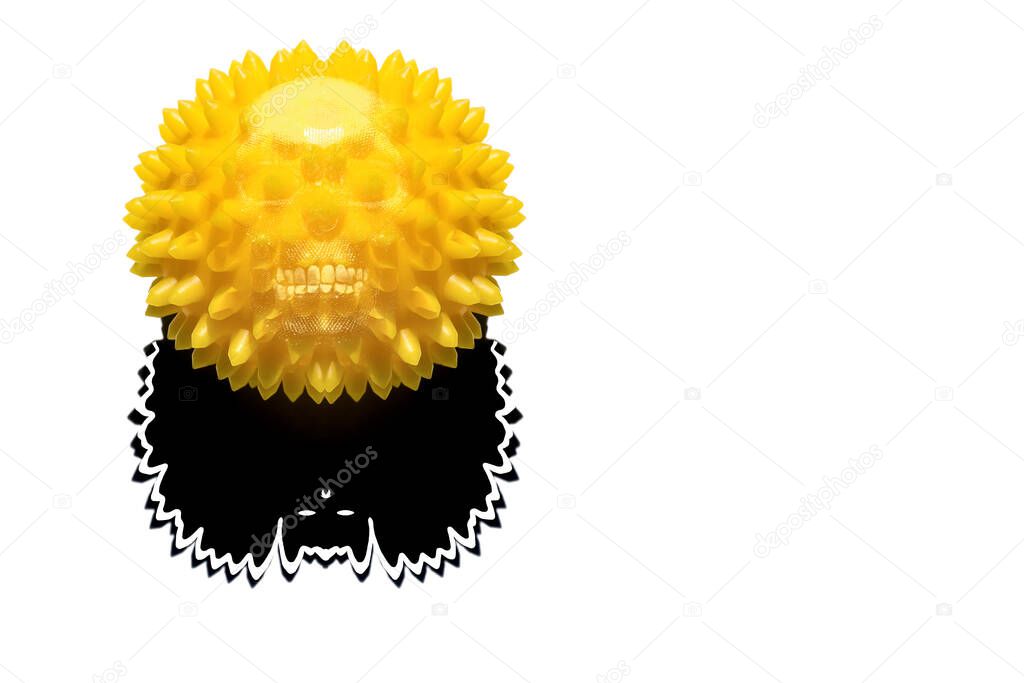 Abstract image of coronavirus. A yellow ball with the silhouette of a skull and a shadow in the form of a bat are located on a white background. 