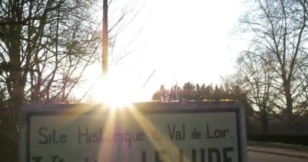 Le Lude Village entrance with beautiful sun and lense flare. Le Lude, France - 26-2-2019 — Stock Video