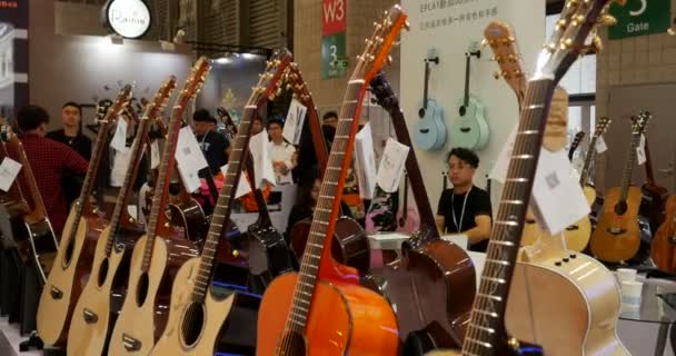 Guitars Ukulele Music China Shanghai Instrument Fair Guitar Fretted String — Stockvideo