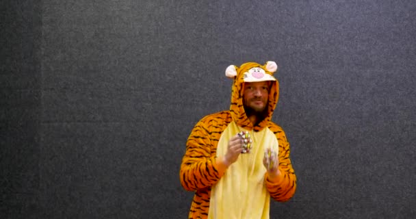 Funny Teacher Wearing Tiger Pajama Clothes Playing Christmas Bells Musical — Stockvideo