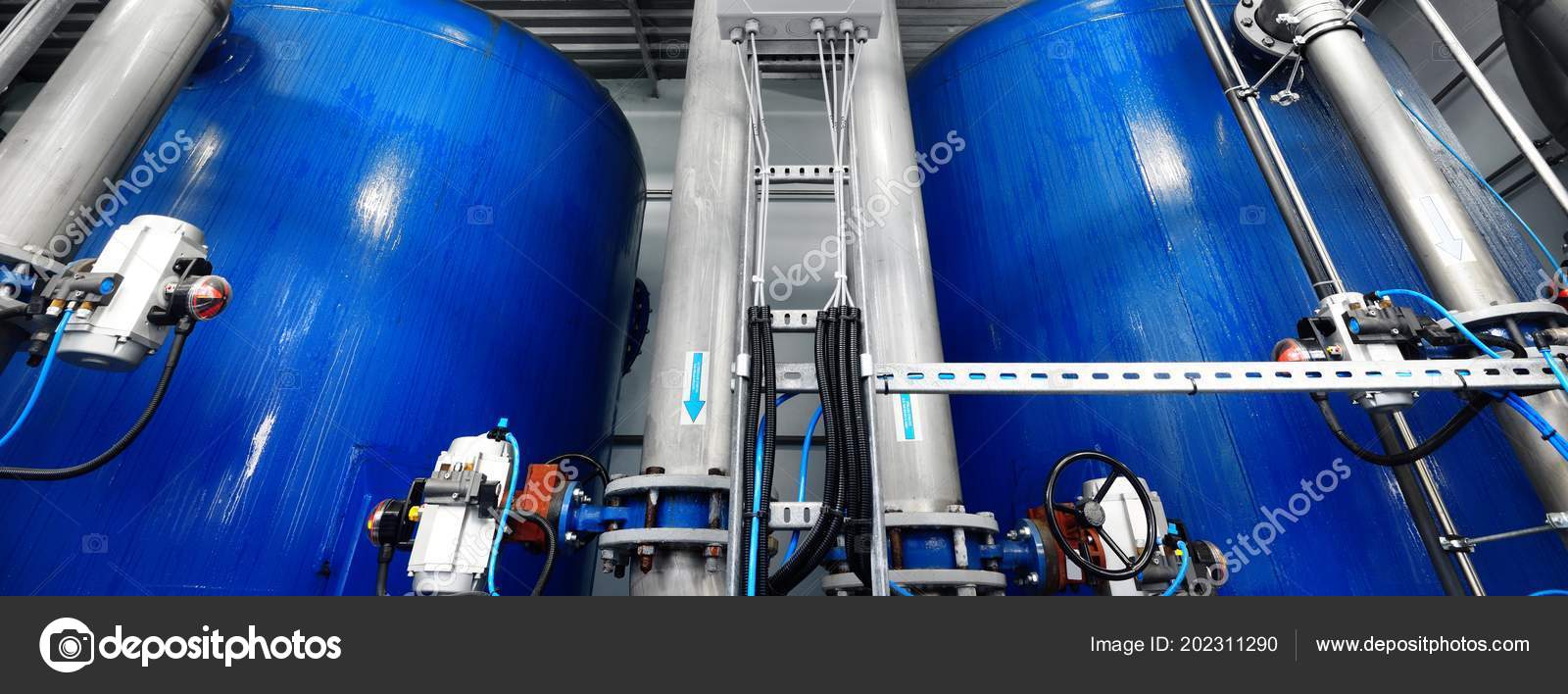 Large Industrial Water Treatment Boiler Room Shiny Steel Metal Pipes