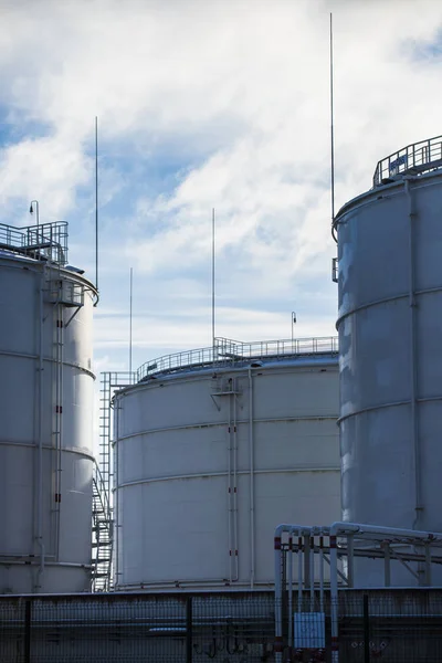 Close-up of the fuel tanks in the port on a cloudy winter day