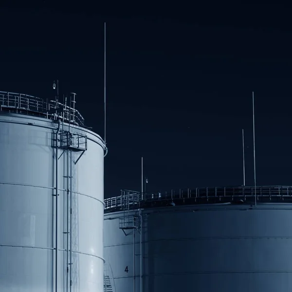 Fuel tanks in port at night time