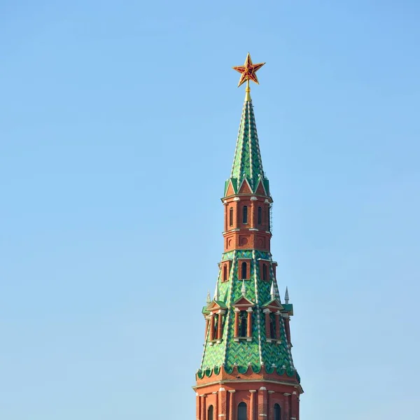 Tower with red ruby star in Moscow Kremlin against blue sky