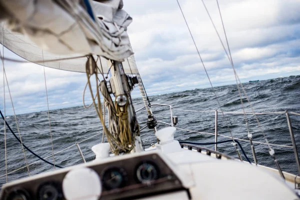 Winter sailing. A view from the yacht's deck to the bow. Baltic sea, Latvia