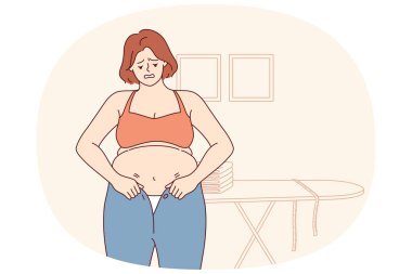 Aşırı kilolu bir kadın küçük pantolon giymeye çalışır ve diyete ihtiyaç duyar. Aşırı kilolu bir kız, obezitenin sebep olduğu karın ve selülit görüntüsünden dolayı kıyafetlere sığmaz.