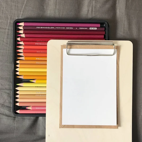 Postcard with Envelope and Pencils on Clipboard