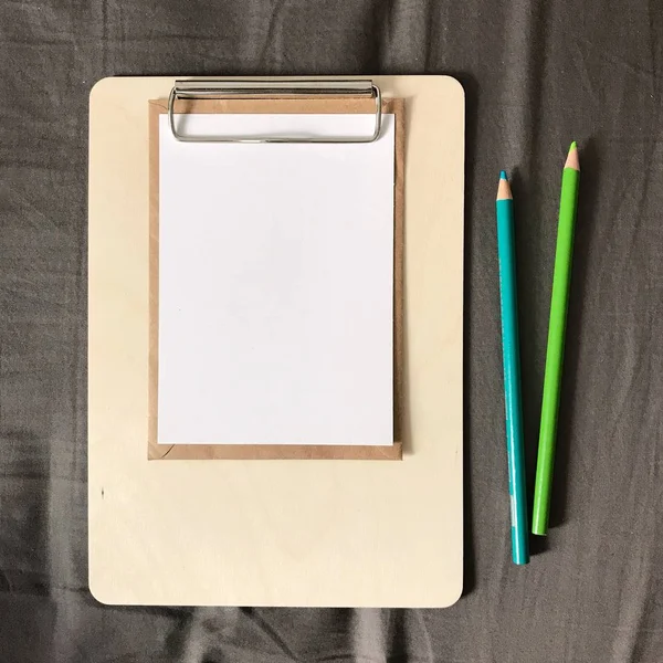 Postcard with Envelope and Pencils on Clipboard — Stock Photo, Image