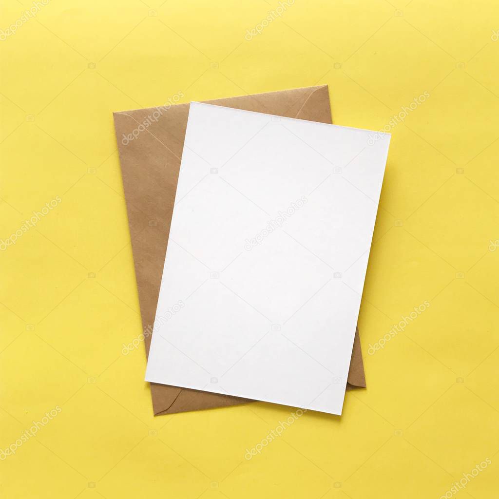 Blank White Postcard Envelope on Yellow Background