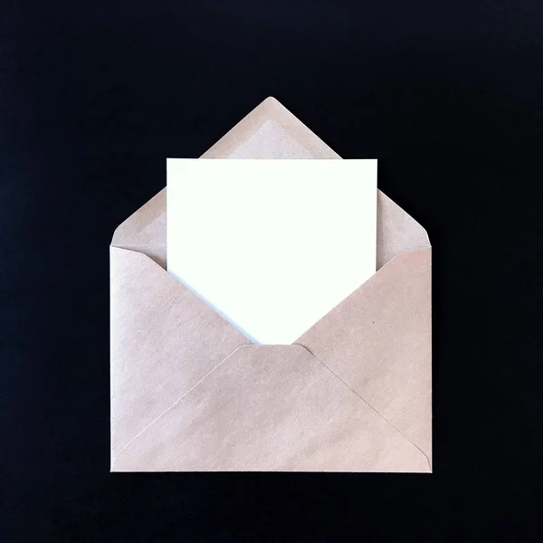 Blank Postcard in Envelope on Black Mockup