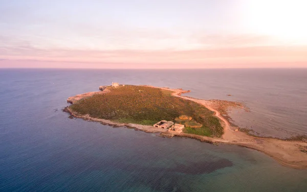 Sunset aerial view of the  island of Portopalo and its coastline