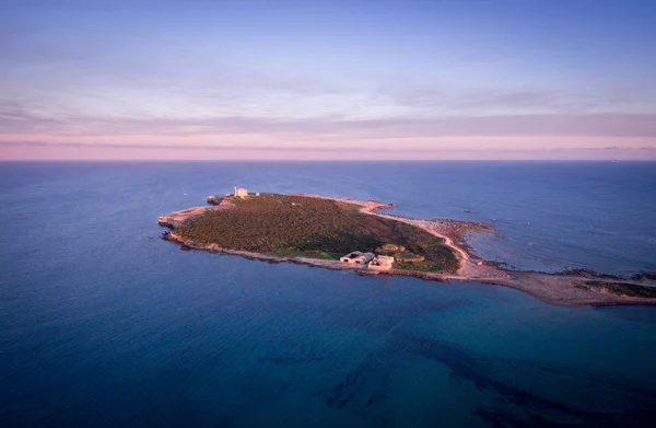 Sunset aerial view of the  island of Portopalo and its coastline