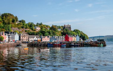 Tobermory / UK - August 25 2019: View of the waterfront. Tobermory is the capital of Mull, and until 1973 the only burgh on, the Isle of Mull in the Scottish Inner Hebrides. clipart