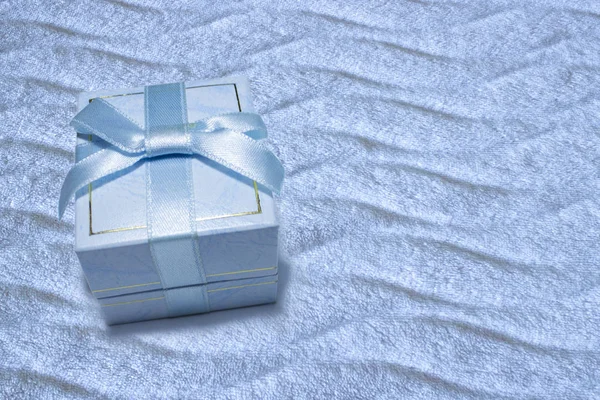 Jewelry gift box with delicate light blue color on gradient back