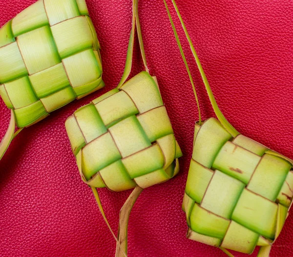 Ketupat Pouches on a red background. Ketupat is a type of dumpli