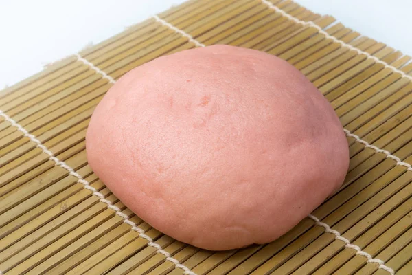 Japanese Snack - Pink Melon Pan on rattan mat