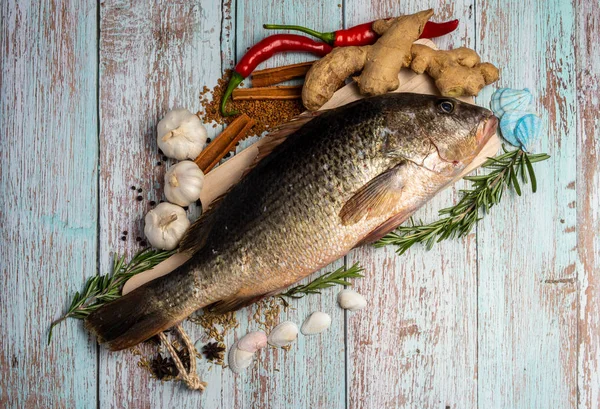 Fresh Fatty Fish on wooden table — Stock Photo, Image